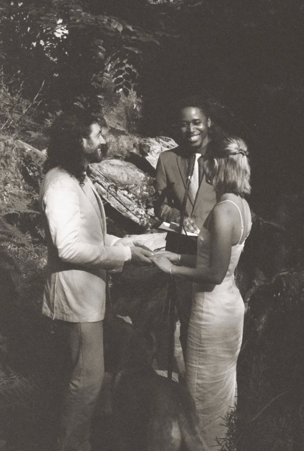 Kayla Strom and Tucker Levy, owners of Kosmo Farm, at an outdoor ceremony — sepia film photo